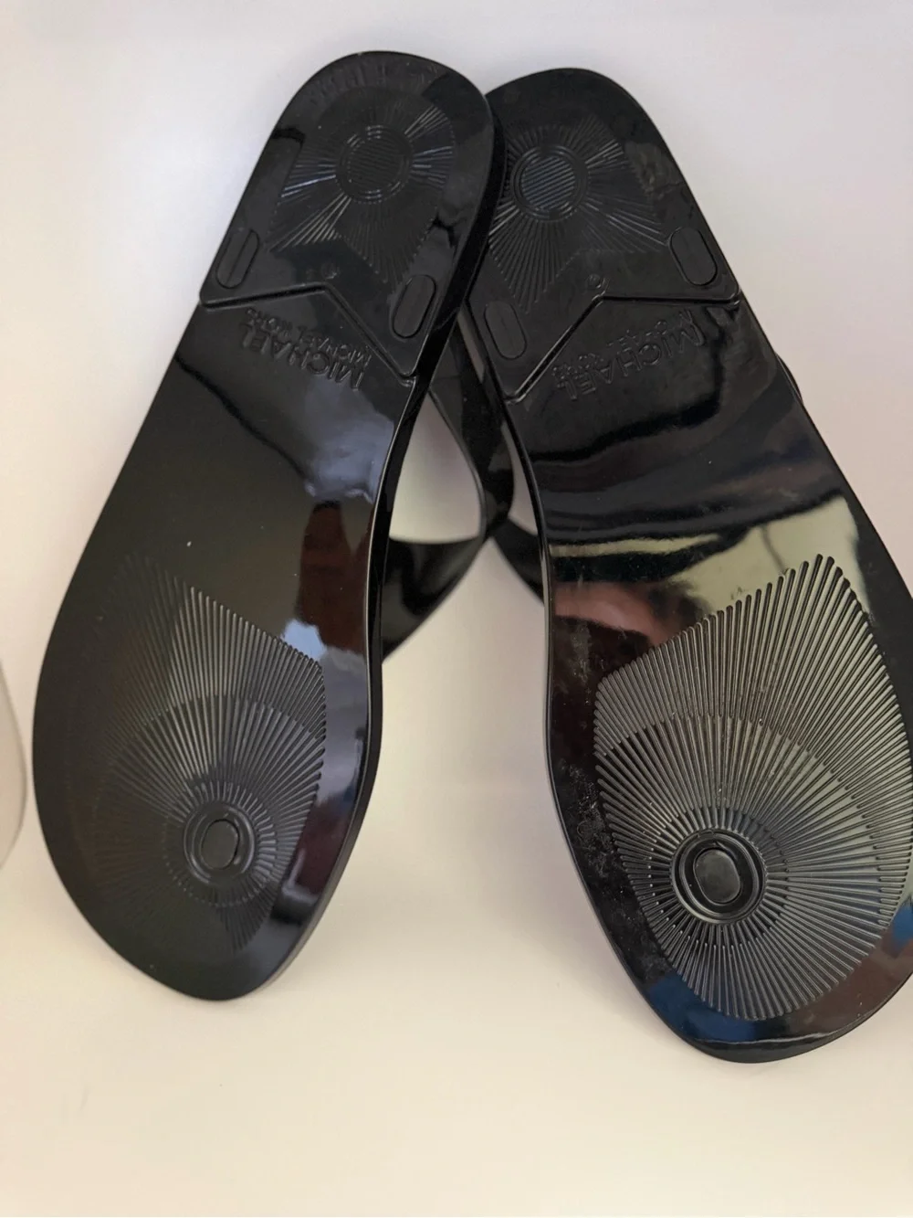 Michael Kors Black Patent Logo Jelly Thong Sandals with Gold Emblem